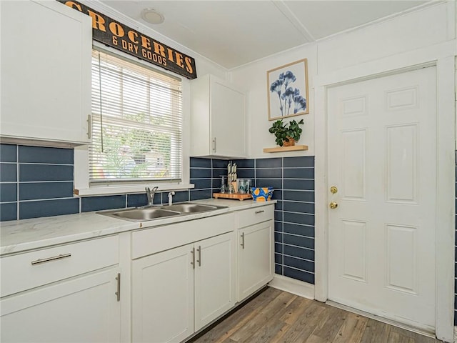 2047 38th Ave, Vero Beach, FL 32960 - kitchen featuring white cabinets, dark wood-type flooring, crown molding, and decorative backsplash