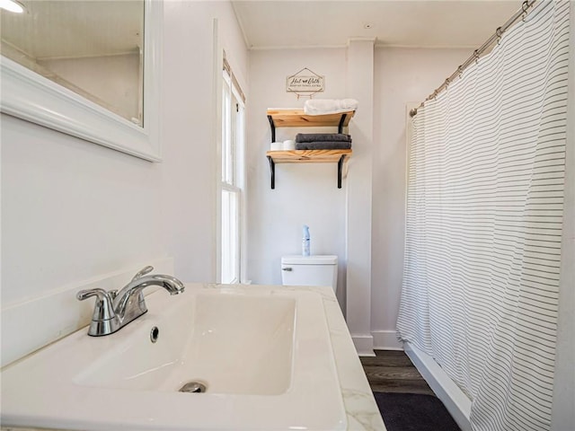 2047 38th Ave, Vero Beach, FL 32960 - bathroom with wood finished floors and a shower with shower curtain