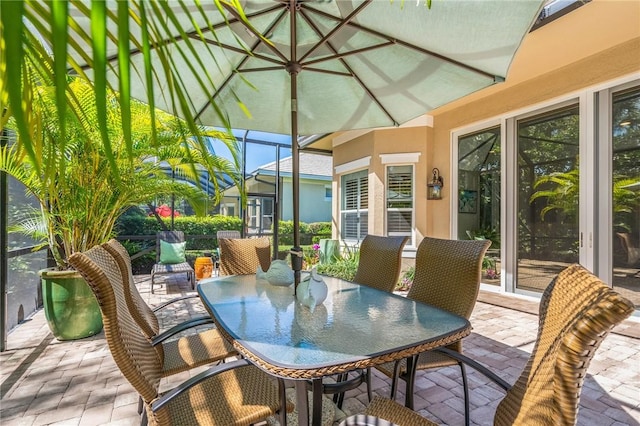 sunroom featuring lofted ceiling