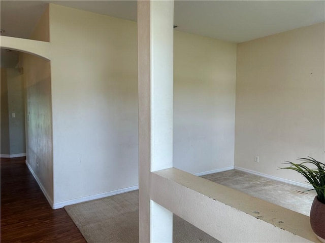 8475 101st Ct, Vero Beach, FL 32967 - corridor with baseboards and wood finished floors