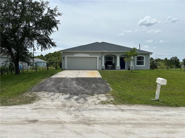 8475 101st Ct, Vero Beach, FL 32967 - ranch-style home featuring asphalt driveway, stucco siding, an attached garage, and a front yard