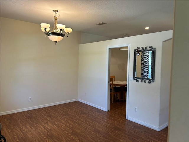 8475 101st Ct, Vero Beach, FL 32967 - spare room with wood finished floors, a chandelier, and recessed lighting