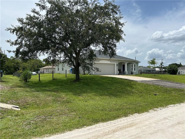 8475 101st Ct, Vero Beach, FL 32967 - ranch-style house featuring concrete driveway, a garage, and stucco siding