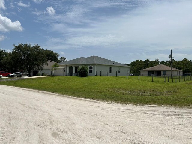 8475 101st Ct, Vero Beach, FL 32967 - view of front of home featuring driveway and an attached garage