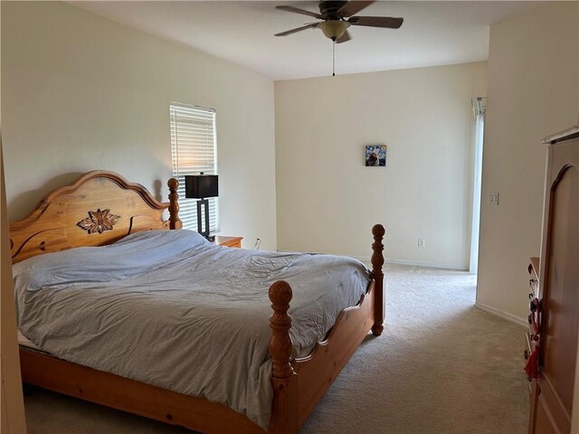 8475 101st Ct, Vero Beach, FL 32967 - carpeted bedroom featuring baseboards and a ceiling fan