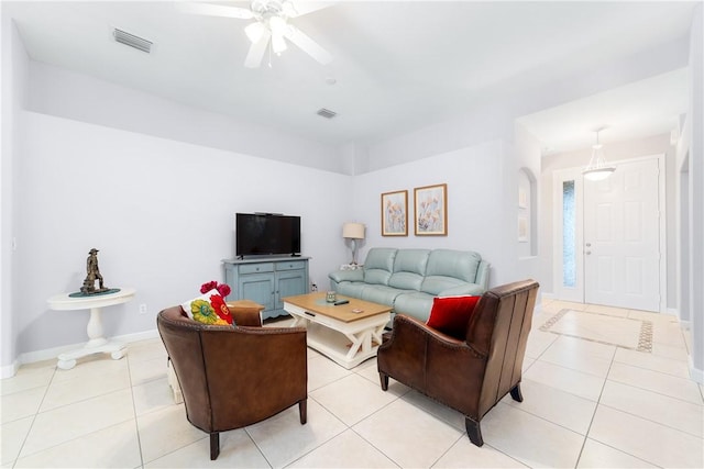 living room with light tile patterned flooring and ceiling fan