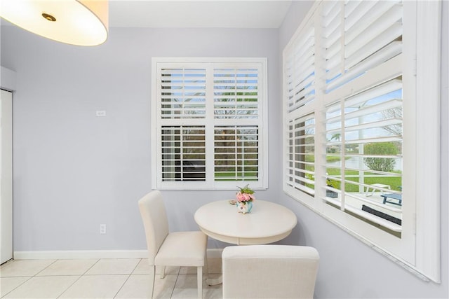 dining space with light tile patterned flooring