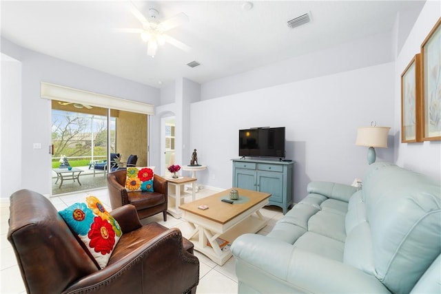 living room with light tile patterned floors and ceiling fan