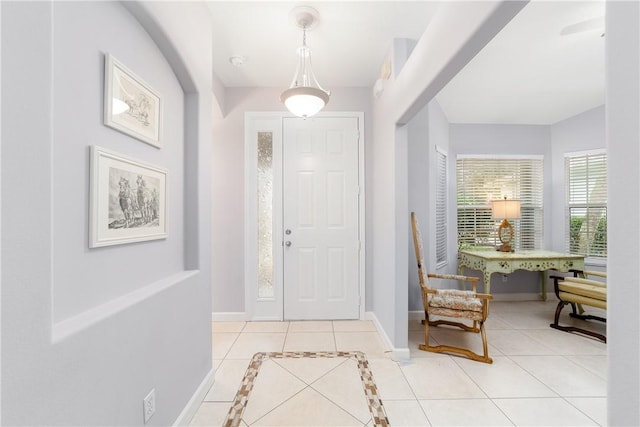 entryway with light tile patterned floors