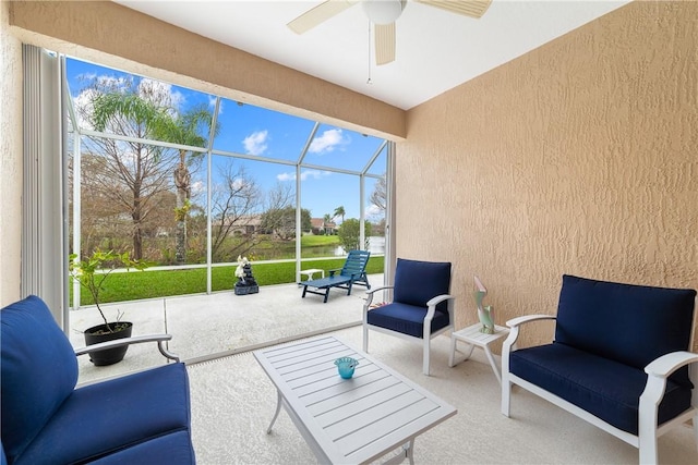 interior space featuring ceiling fan and glass enclosure