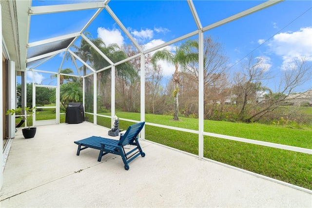 unfurnished sunroom featuring vaulted ceiling