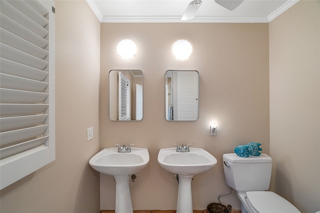 bathroom featuring toilet and ornamental molding