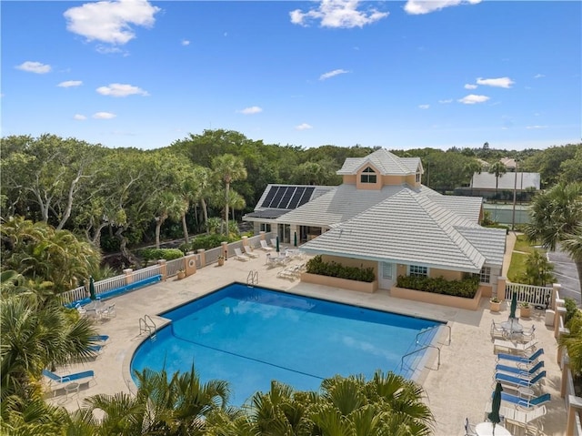 view of swimming pool featuring a patio area