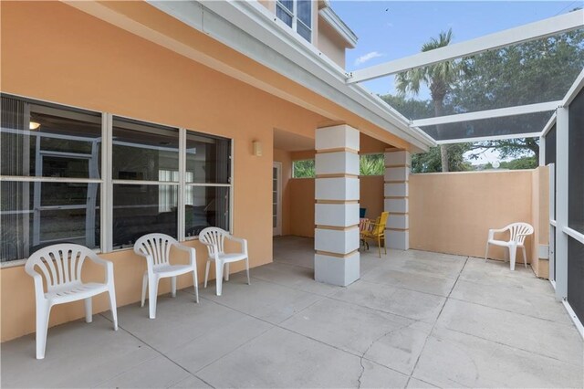 view of patio / terrace with glass enclosure