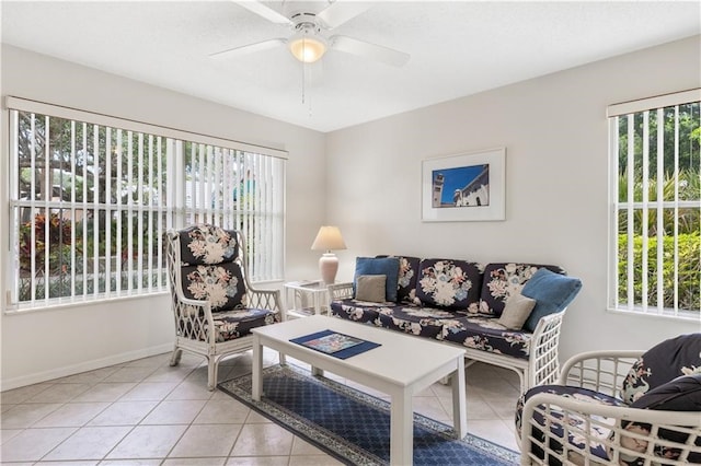 living room with ceiling fan and light tile patterned floors