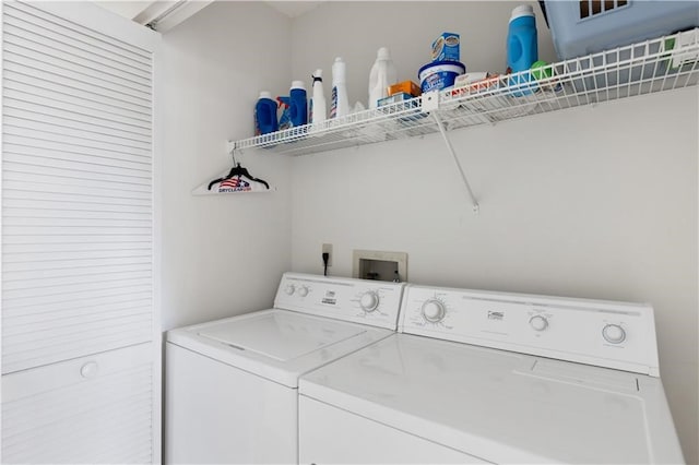 washroom featuring washing machine and dryer