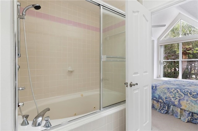 bathroom featuring bath / shower combo with glass door