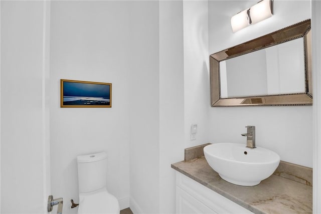1242 River Reach Dr, Vero Beach, FL 32967 - bathroom featuring vanity and toilet