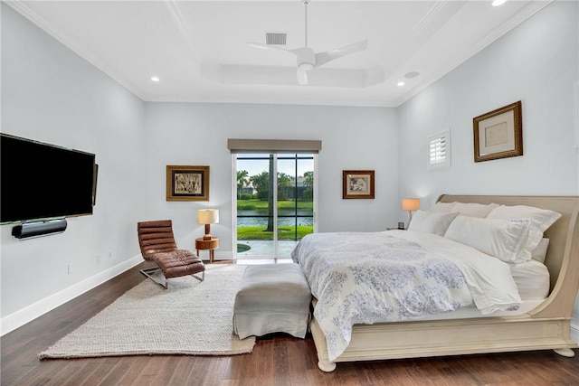 1242 River Reach Dr, Vero Beach, FL 32967 - bedroom featuring access to outside, a tray ceiling, ornamental molding, wood finished floors, and recessed lighting