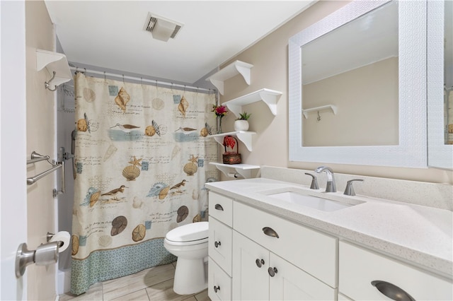 bathroom featuring a shower with curtain, visible vents, vanity, and toilet