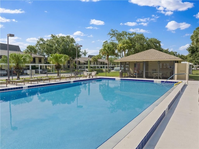 community pool featuring fence