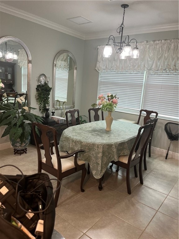 tiled dining area with ornamental molding and a chandelier