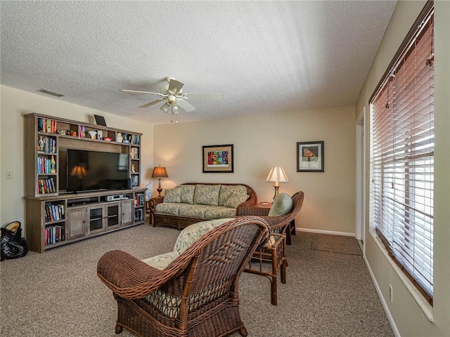 2800 Indian River Blvd Unit 10R, Vero Beach, FL 32960 - living room featuring a textured ceiling, a ceiling fan, and carpet