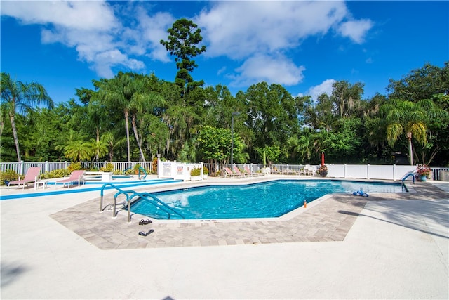 view of swimming pool with a patio area