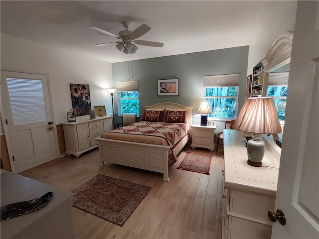 bedroom featuring light hardwood / wood-style flooring and ceiling fan