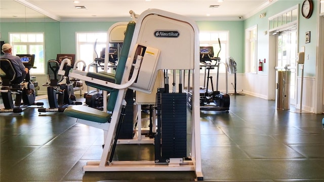 exercise room featuring ornamental molding