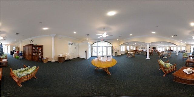 exercise room with decorative columns and ceiling fan