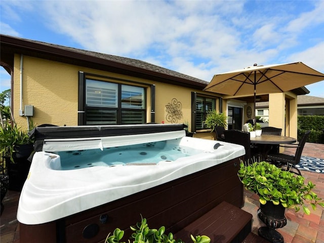 view of patio with a hot tub