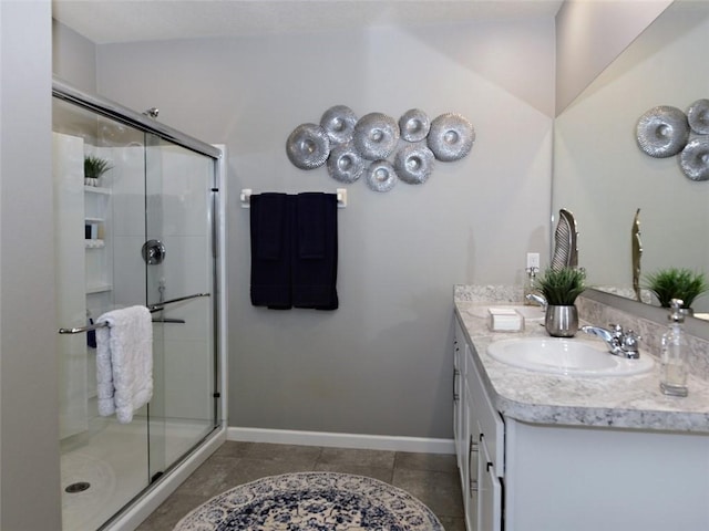 bathroom featuring vanity, tile patterned floors, and walk in shower