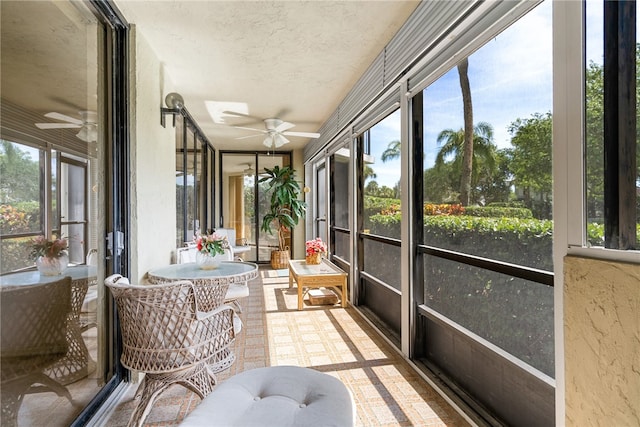 sunroom / solarium with ceiling fan