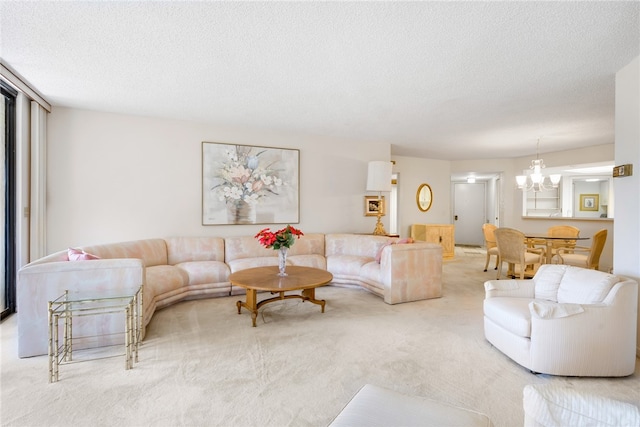 carpeted living room featuring a textured ceiling and a notable chandelier