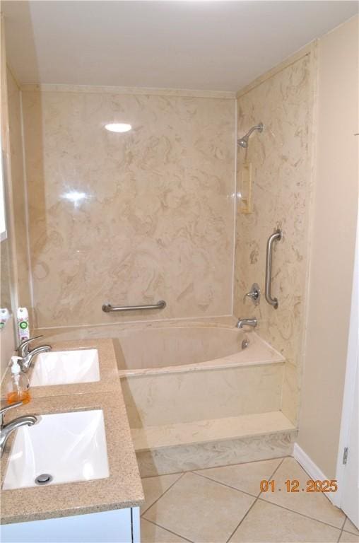 bathroom with tiled shower / bath, tile patterned floors, and vanity