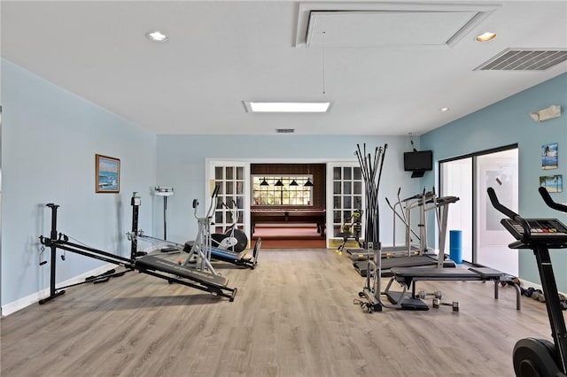 exercise area featuring hardwood / wood-style floors