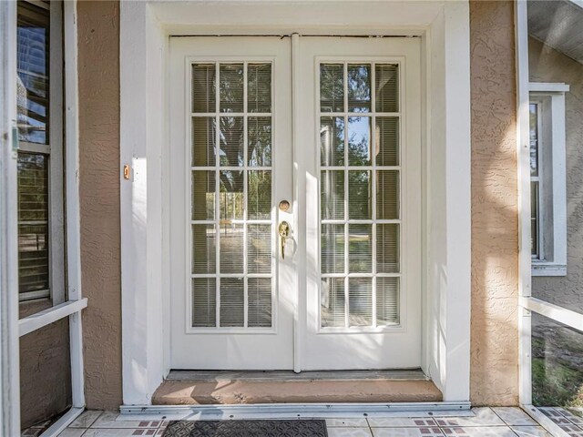 doorway to property featuring french doors