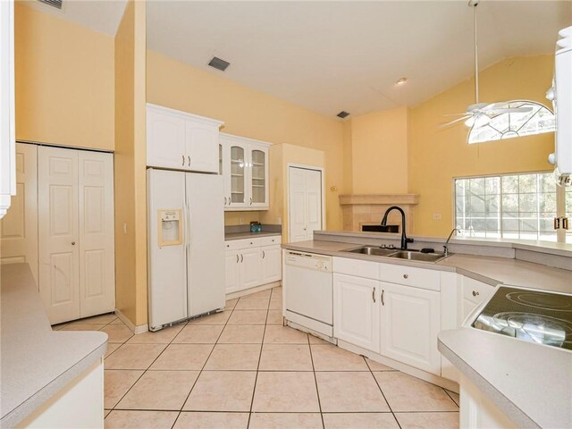 kitchen with white appliances, sink, ceiling fan, light tile patterned floors, and white cabinetry