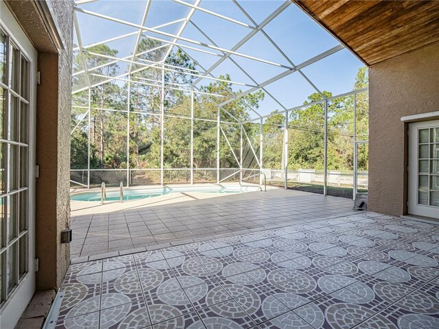 view of patio / terrace with a lanai