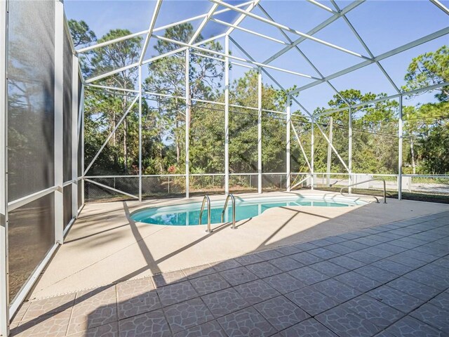 view of pool featuring a lanai and a patio