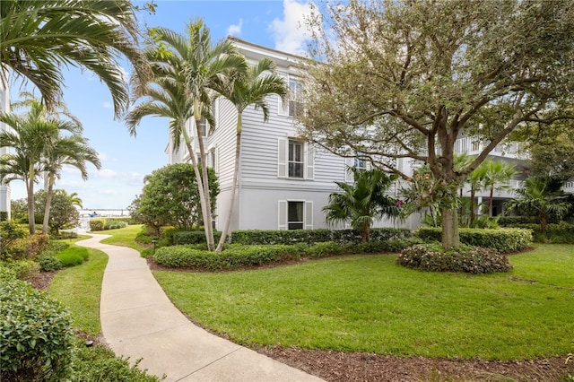 view of side of property featuring a yard