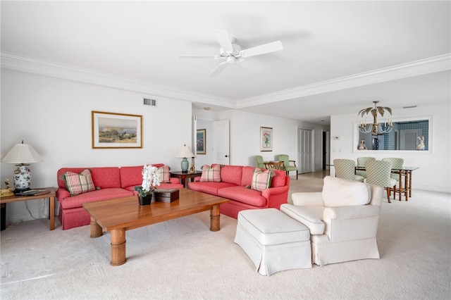 living room featuring light colored carpet, ornamental molding, and ceiling fan with notable chandelier