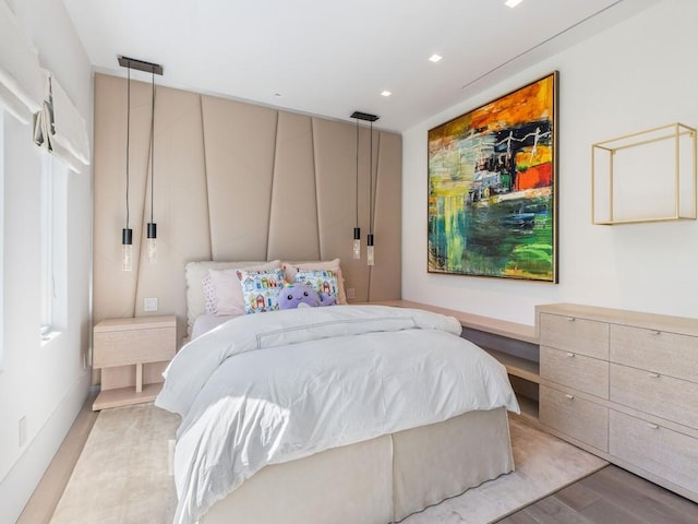 bedroom featuring light wood-type flooring