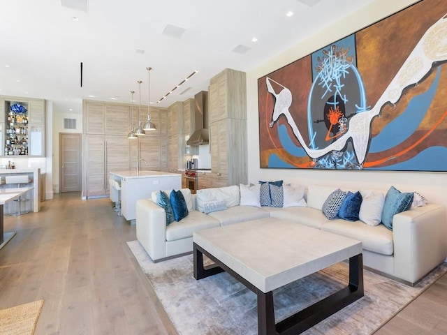 111 Mariner Beach Ln, Vero Beach, FL 32963 - living room with light wood-style flooring and recessed lighting