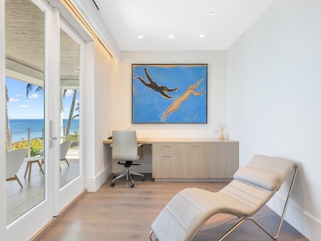111 Mariner Beach Ln, Vero Beach, FL 32963 - office featuring a water view, light wood finished floors, built in study area, and recessed lighting
