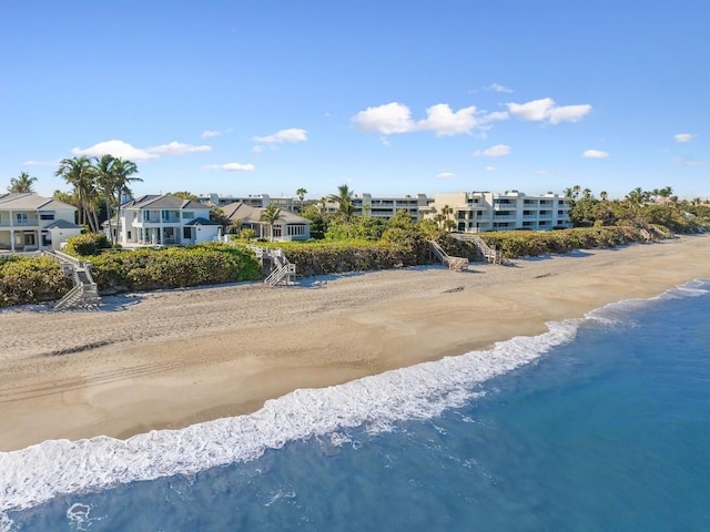 drone / aerial view featuring a view of the beach and a water view