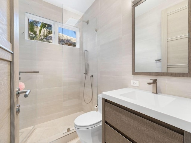 111 Mariner Beach Ln, Vero Beach, FL 32963 - bathroom with a shower stall, vanity, and tile walls