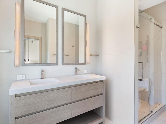 bathroom with vanity and walk in shower