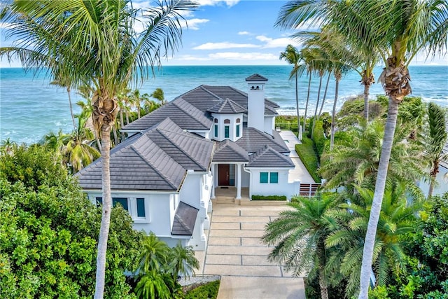 111 Mariner Beach Ln, Vero Beach, FL 32963 - view of front of property with stucco siding, a water view, and a tile roof